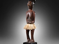 A wooden yaka sculpture, democratic republic of the congo, late 19th/ early 20thc (+) height: 55 cm. (21.64 in.), incl. stand: 63 cm. (24.80 in.)