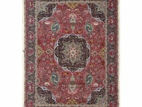 A woollen oriental persian rug, decorated with various birds and animals 301 x 416 cm. (118 1/2 x 163.78 in.)
