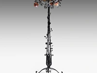 A wrought iron floral decorated floor lamp with glass paste coupe 185 cm. (72.82 in.), ø coupe: 59 cm. (23.23 in.)