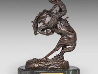 After frederic sackrider remington (1861-1909), 'rattlesnake', patinated bronze on a marble base the bronze: 22 cm. (8.66 in.), including the base: 24.5 cm. (9.65 in.)