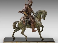 Alfred barye (1839-1882), arab hunter on horseback, various patinated spelter on an onyx base the sculpture: 56 x 46 cm. (22.05 x 18.10 in.), with base: 62 x 72 cm. (24.41 x 28.35 in.)