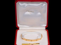 An 18ct yellow gold cartier love bracelet, 6,6 x 5,5, weight: 35,4 g - afbeelding 6 van  7
