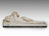 An alabaster reclining female nude among grape vines 17 x 49 cm. (6.69 x 19.28 in.)
