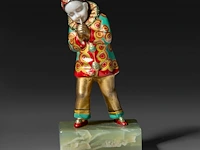 An art deco chryselephantine sculpture of a pierrot on an onyx base, interwar period, total h 12 cm - sculpture h 9,5 cm - total weight 390g (+)