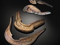 An assembled group of chinese repoussé gilt silver saddle ornaments, liao dynasty (907 - 1125)