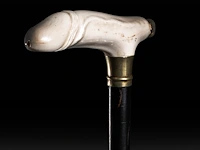 An erotic walking stick with an ivory handle of a phallus also serving as a smoking device, english, 19thc, total h 93 cm - ivory h 4 cm - ivory w 13 cm - total weight 275g (+)