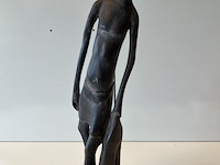 Beeld jonge man met zak - afbeelding 1 van  3