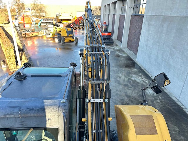 Caterpillar - 2014 - m313d - banden graafmachine - afbeelding 31 van  64