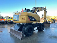 Caterpillar - 2014 - m313d - banden graafmachine - afbeelding 34 van  64