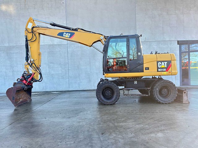 Caterpillar - 2014 - m313d - banden graafmachine - afbeelding 62 van  64