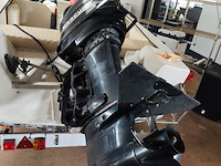Consoleboot ace cruiser composiet van 1982, lengte 4,8m, 6 personen, 75pk 2-takt langstaart buitenmotor van 1989 van het merk mercury. de motor draait en koelt goed. onderhoud is aangewezen. benzineleidingen zijn verduurd waardoor ze lekken - afbeelding 33 van  35