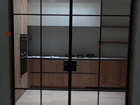 Dubbele smeedwerken deur