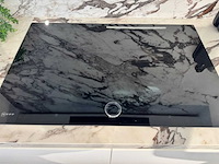 Exclusieve showroomkeuken met luxe keramisch monobloc-eiland, hoogwaardige neff-toestellen en novy dampkap - afbeelding 13 van  23
