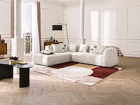 Grote beige fijn geribbelde ribfluweel bank in de linkerhoek van maison céphy - afbeelding 1 van  11