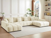 Grote panoramische hoekbank van beige stof met textuur