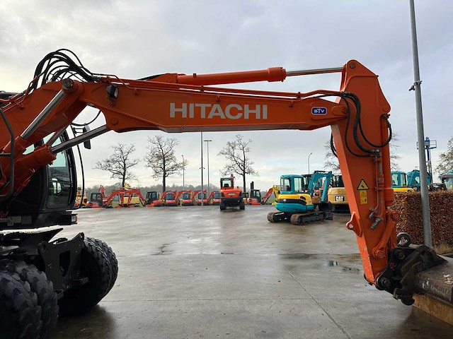 Hitachi - 2012 - zx145w-3 - banden graafmachine - afbeelding 7 van  47
