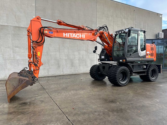 Hitachi - 2012 - zx145w-3 - banden graafmachine - afbeelding 1 van  47