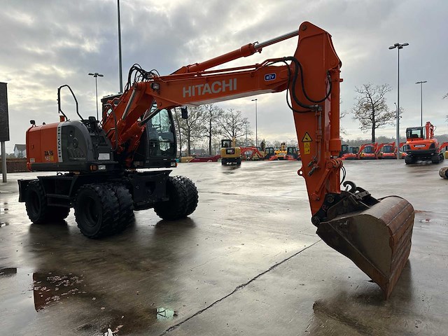 Hitachi - 2012 - zx145w-3 - banden graafmachine - afbeelding 23 van  47