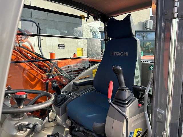 Hitachi - 2012 - zx145w-3 - banden graafmachine - afbeelding 35 van  47