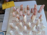 Lot 33 - vintage handgensneden afrikaans schaakspel uit natuursteen - afbeelding 1 van  2