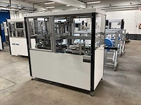 Machine voor assemblage mondmaskers