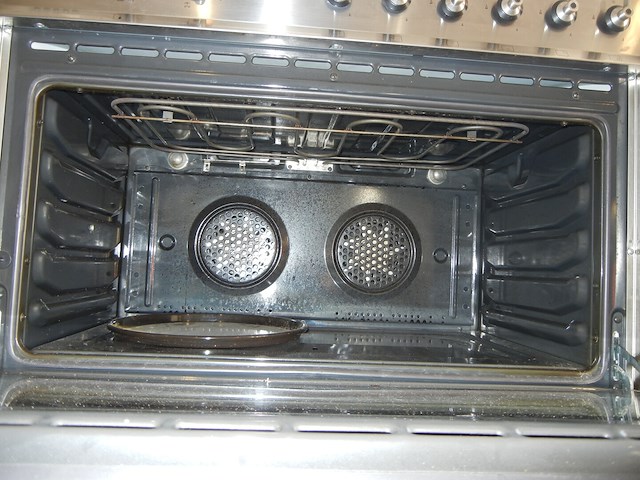 Oven multi functioneel in inox met 6 vuurpitten, merk smeg, met achterplaat en dampkap (siemens) - afbeelding 8 van  12