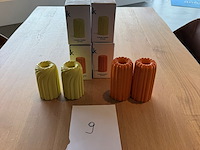 Partij gekleurde kaarshouders