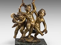 Raphaël charles peyre (1872-1949), a patinated bronze group of three music-making putti the bronze: 60 cm. (23.62 in.), with marble base: 65.5 cm. (25.78 in.)