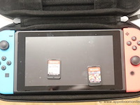 Spelconsole nintendo switch plus 2 spelletjes, zonder kabels werking niet gekend - afbeelding 2 van  4