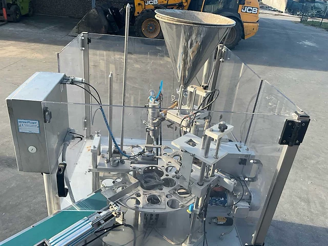 Techniplast automatische draaipotvullings-/verpakkingsmachine techniplast – automatische draaipotvullings- en verpakkingsmachine – yoghurt / voedingsproducten – roestvrij staal - afbeelding 21 van  22