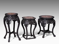 Three chinese carved hardwood bases, open-work carved with a floral motif, late qing, h 48 - 49 - 61 cm