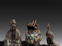 Three japanese champlevé enameled bronzes; one figure depicting kannon, the other a peacock; added a censer, signed, 19th/20thc, tallest h 39,5 cm