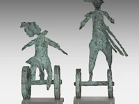 Two green patinated bronze sculptures by inge dewilde (1957) smallest: 33 cm. (12.99 in.), tallest: 44 cm. (17.32 in.)