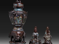 Two japanese champlevé enamelled bronzes, one depicting kannon, the other an immortal; added a ditto large vase decorated with elephants and shishi, meiji period (1868-1912), h 37 cm (both figures) / h 93 cm (vase)