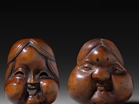 Two japanese wood netsuke of masks, edo period (19thc), both h 5 cm
