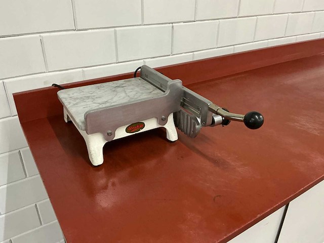 Unika - verwarmde hand kaassnijder - afbeelding 1 van  3