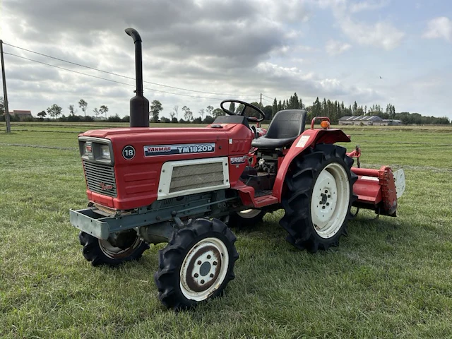 Yanmar ym1820d vierwielaangedreven minitractor met grondfrees - afbeelding 1 van  25